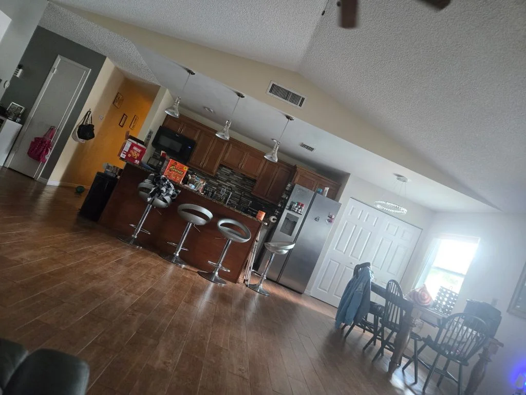 Before: crooked, dim phone photo of a kitchen